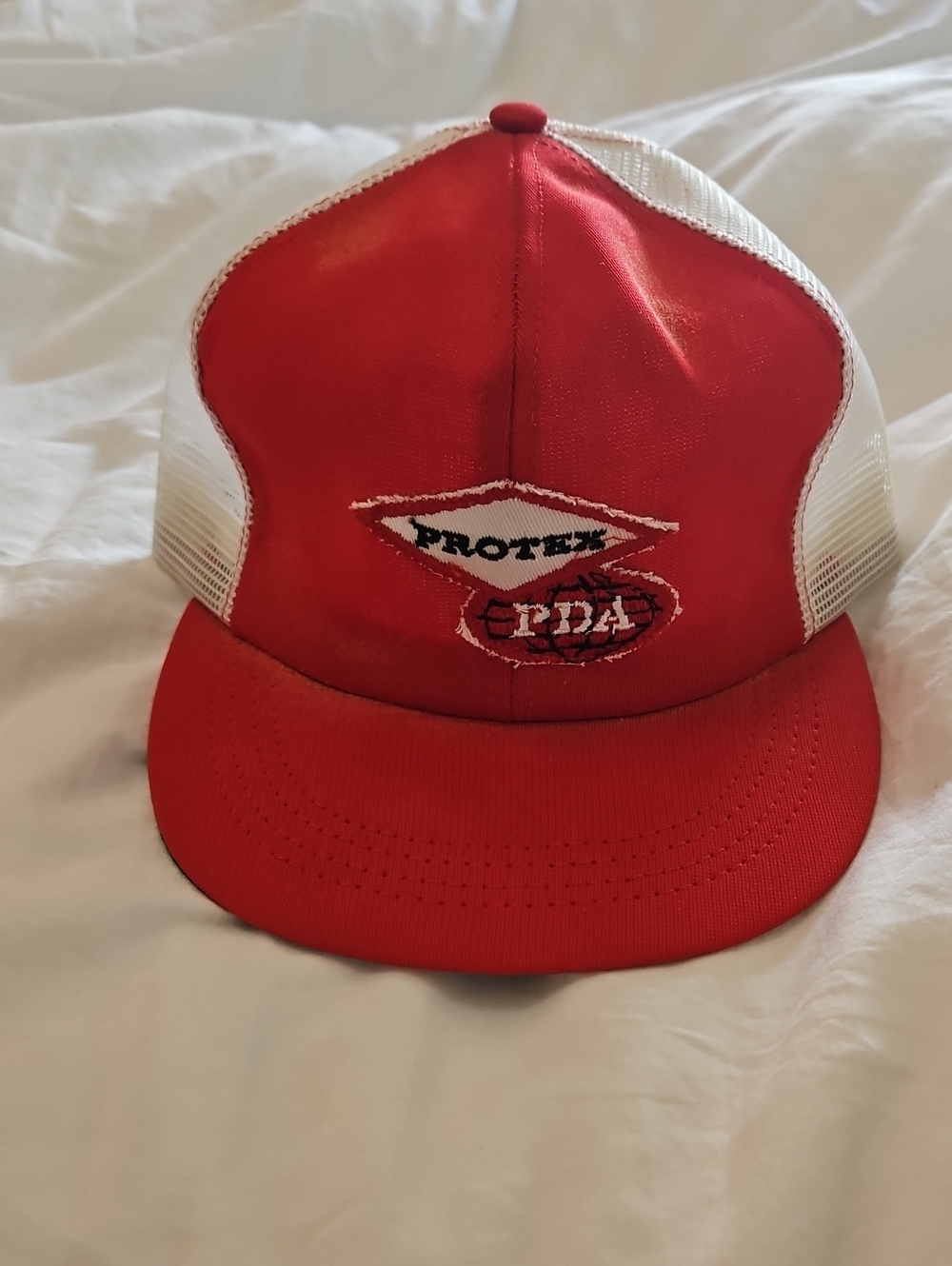 Red and White Mesh Trucker Hat with Protex "pda" Front Patch